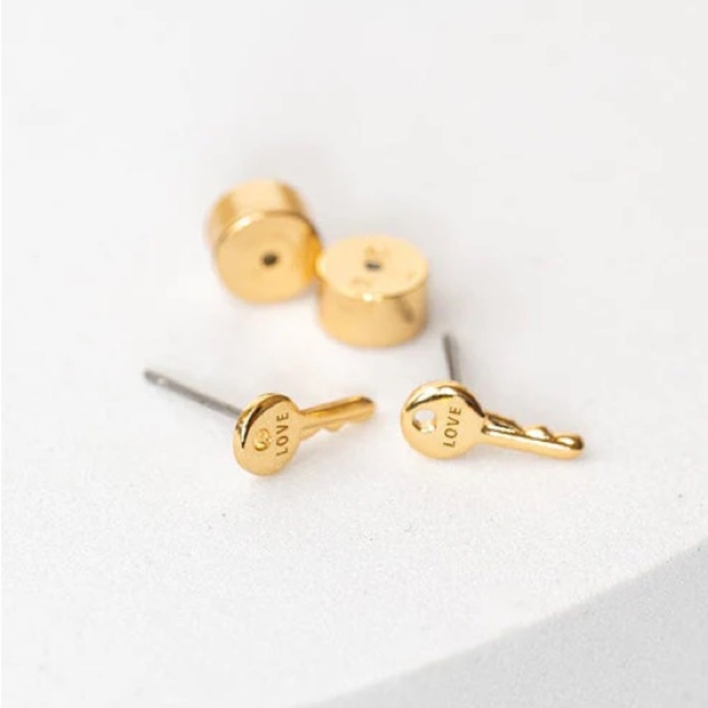 Care Tucker “Love” key post earrings gold